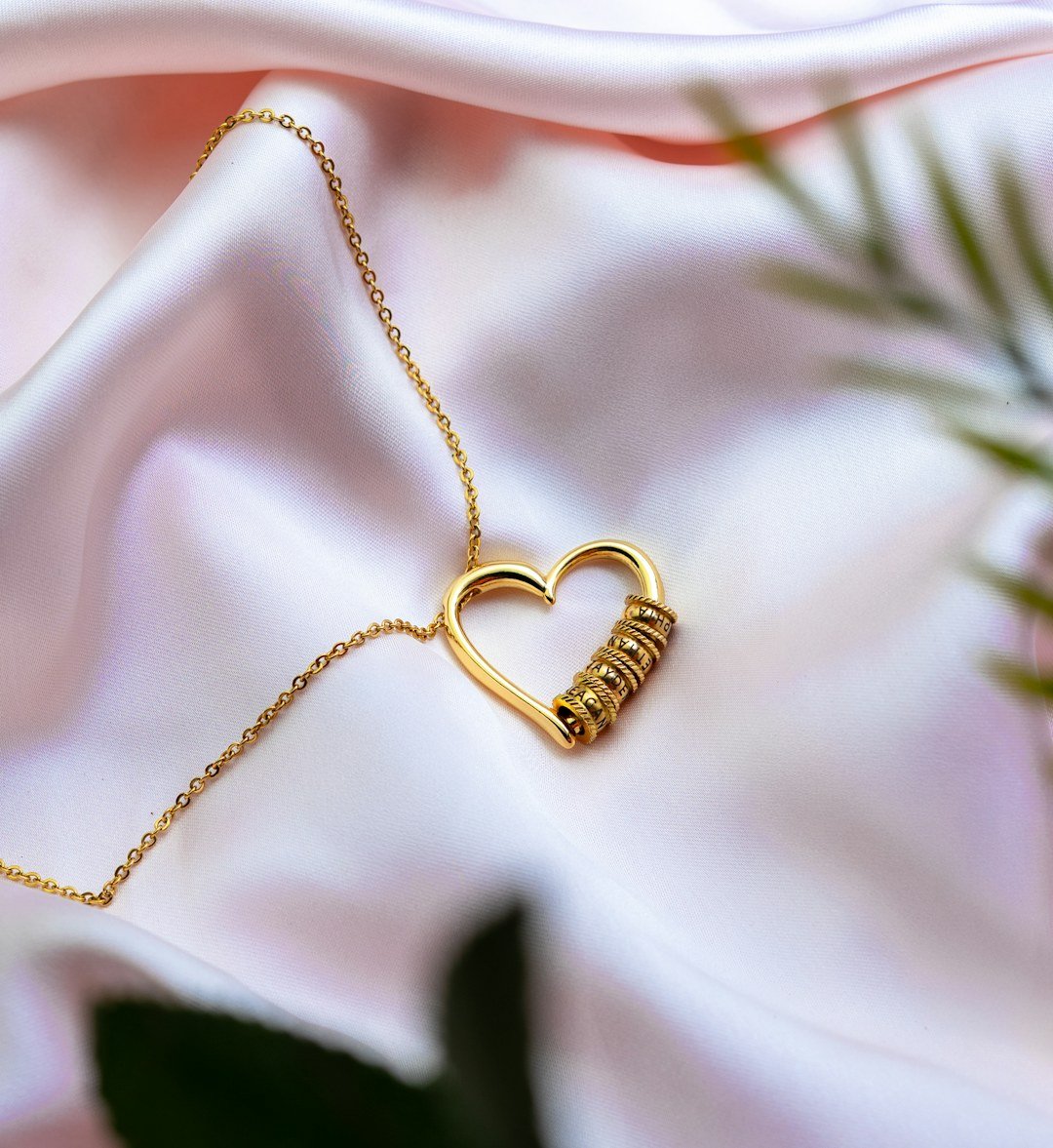 Gold necklace on satin